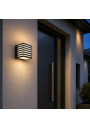 Wall Cube GX53 beside a modern entrance door at dusk