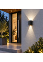 Kiron Round wall light by an entrance – asymmetric up-and-down light distribution