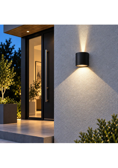 Kiron Round wall light by a home entrance – narrow upper beam and wide lower beam