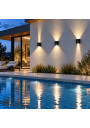 Three Kiron Round wall lights by a pool – decorative up-and-down lighting
