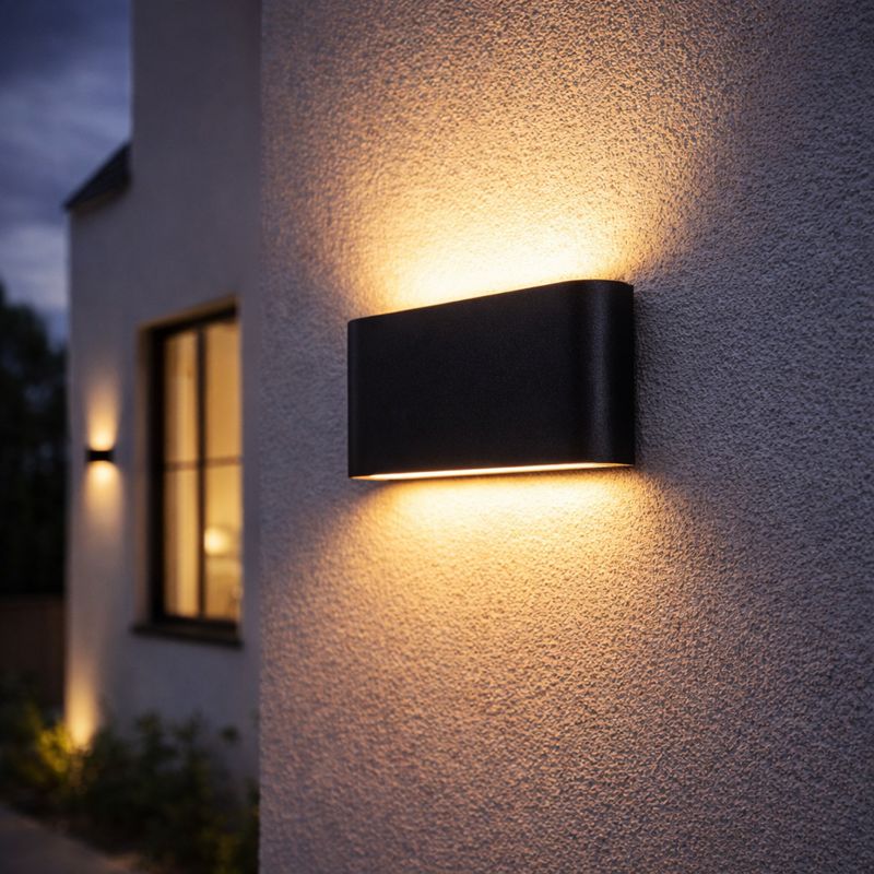 Minimalist Lumina LED facade luminaire on a modern exterior wall
